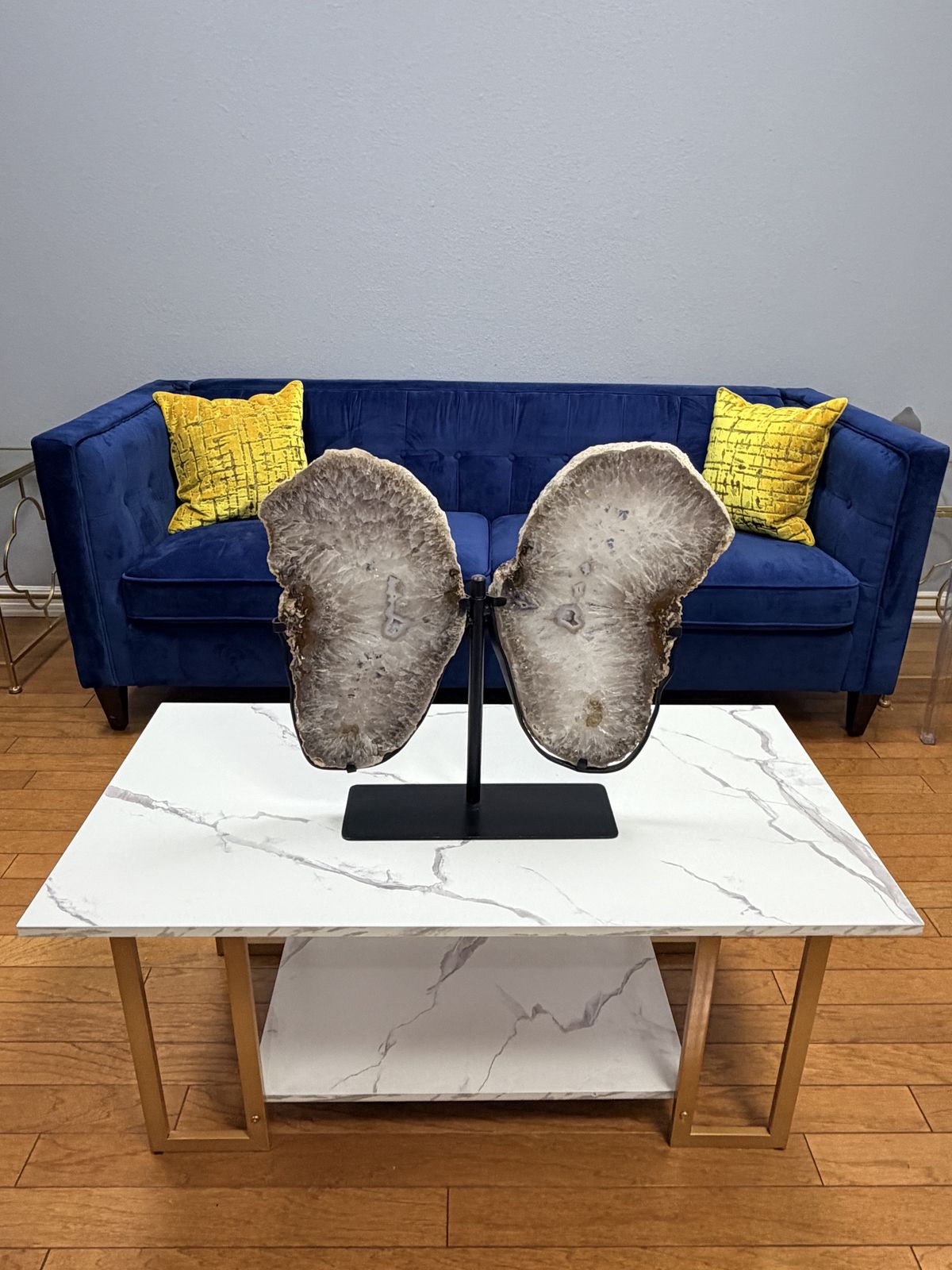 Agate butterfly sculpture in front of the lounge sofa